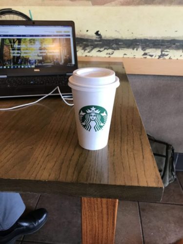 Starbucks cup on table