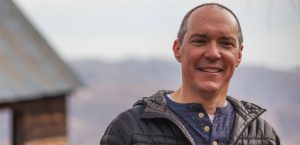 Roger Hall of Compass Consultation smiling outdoors
